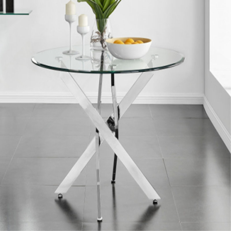 Le plateau de table circulaire en verre trempé moderne est jumelé à un cadre en fer mesurant 35,43 pouces de longueur.