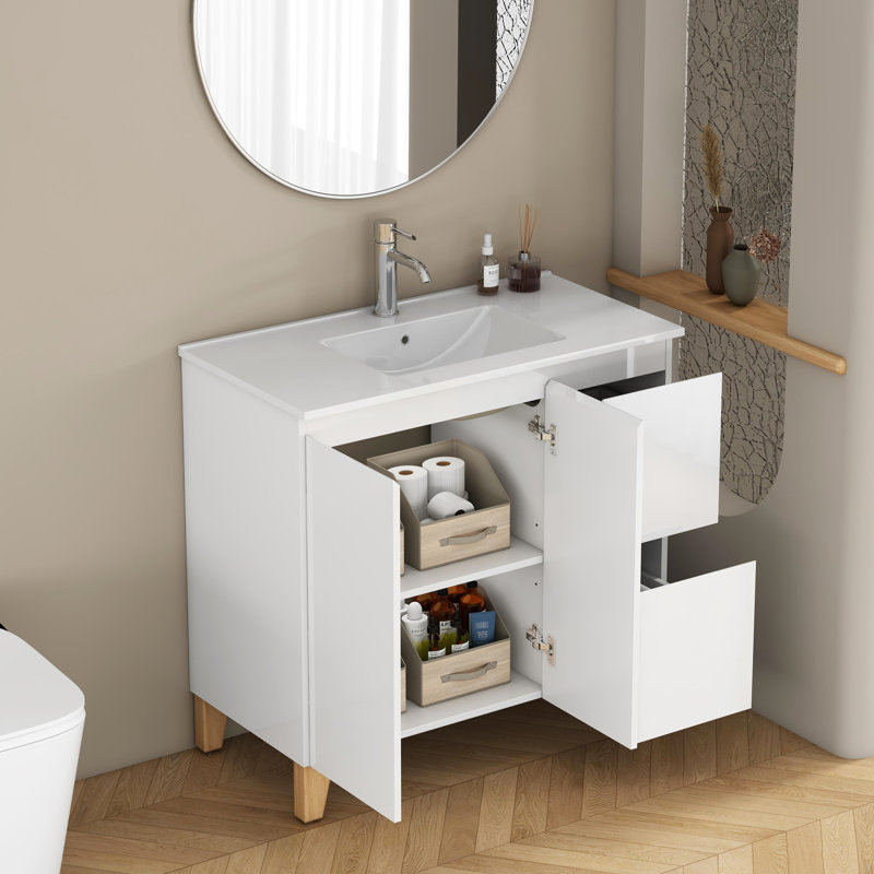 Meuble-lavabo moderne de 91 cm (36 pouces) avec lavabo intégré, 2 portes et tiroirs à fermeture amortie, poignées élégantes, pieds en bois naturel, lavabo en céramique blanche facile à installer, tiroirs et placards de rangement.