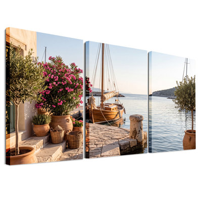 Voilier en bois amarré à un quai en pierre avec ensemble de 3 toiles murales roses