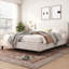 Très grand lit plateforme tapissier avec tête de lit à oreilles beige
