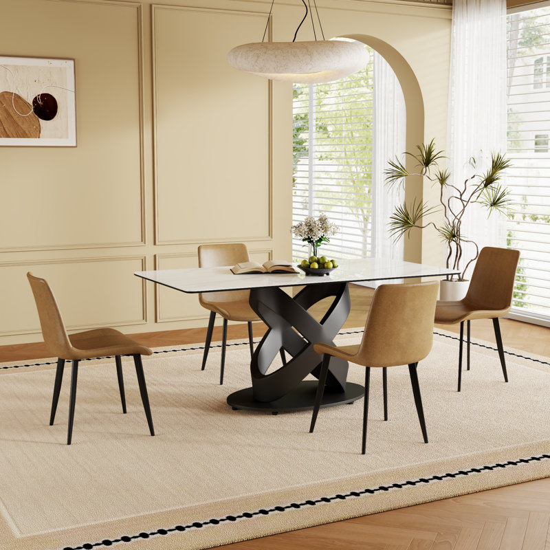Ensemble de table de salle à manger spacieux et moderne avec plateau en pierre frittée et base en acier au carbone pour des réunions élégantes