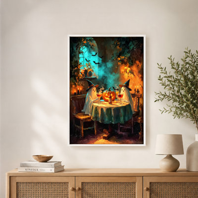 Tableau sur toile avec cadre flottant, prêt à accrocher, représentant deux silhouettes fantomatiques d'Halloween, chapeaux de sorcière, toast au vin, citrouilles et chauves-souris.