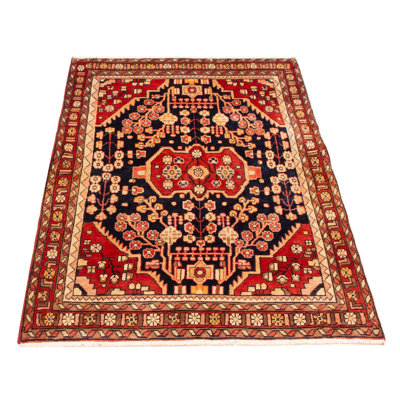 Splendid piece of work that is woven in Turkey with a re-interpretation of village Persian designs. The vintage and distressed look make this hand-knotted wool rug a natural standout.
