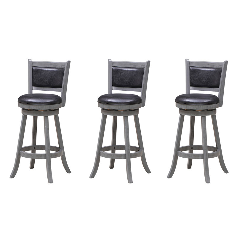 Ensemble de trois tabourets de bar adossés par la salle de jeux RAM, Gris