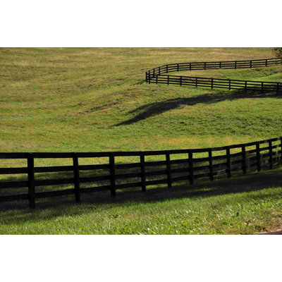 «Black Fence in Green Field» - Photographie sur toile tendue