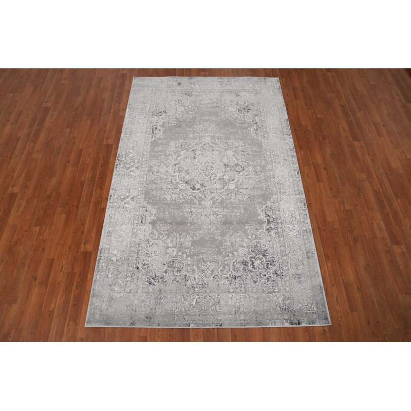 Design intemporel: élégant tapis gris 5 x 8 avec touche rétro