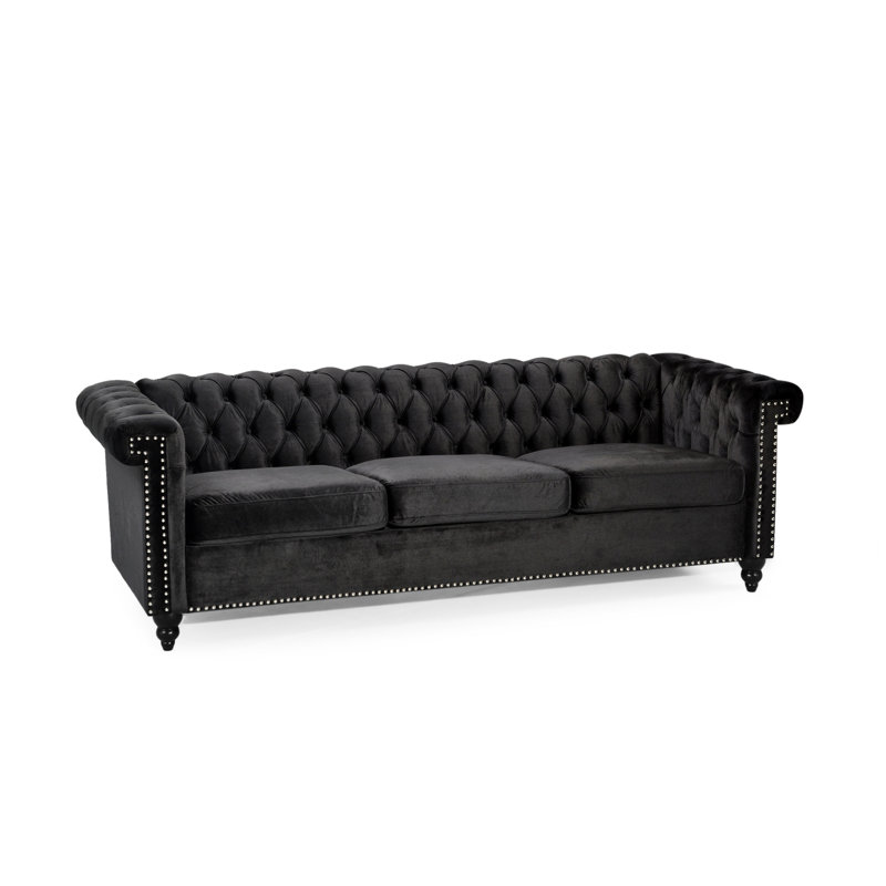 Charmant fauteuil 3 places en velours noir avec capitonnage à boutons profonds et ambiance invitante - 3 matériaux gracieux