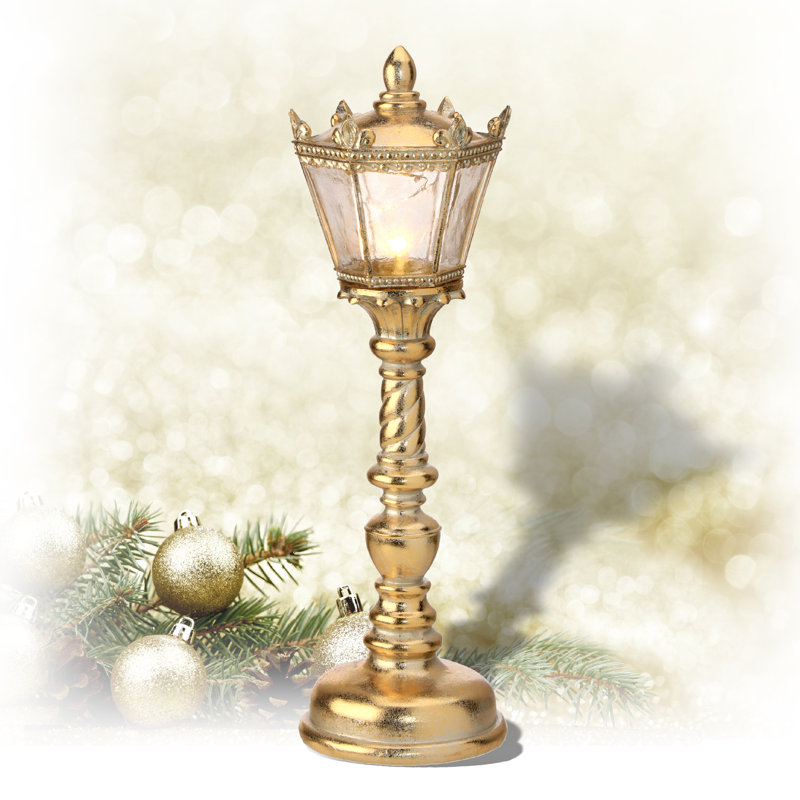 Lampe à pile dorée ornée