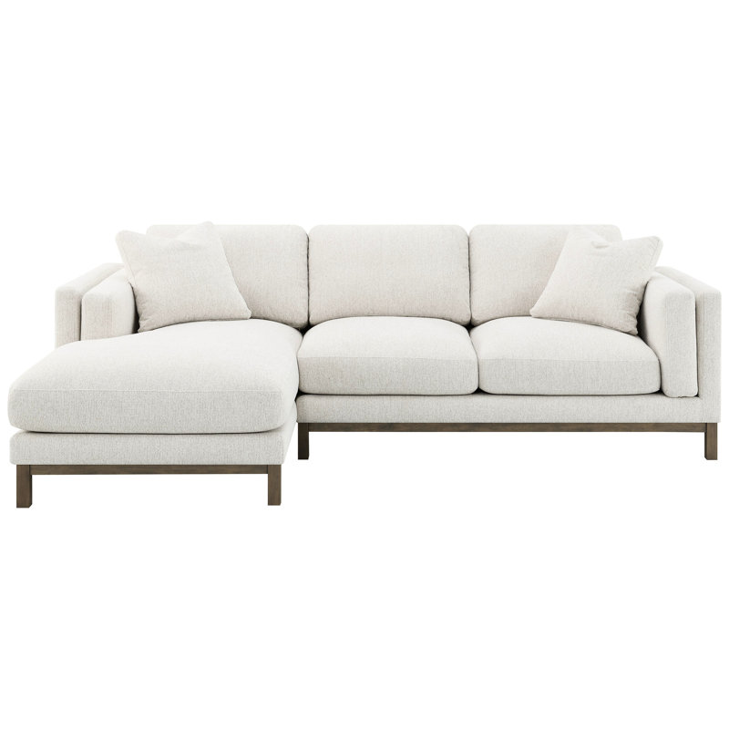Canapé d'angle en tissu sable avec dossier capitonné et coussins à garnissage mixte, pour un style de vie décontracté. Solution d'assise confortable en forme de L.