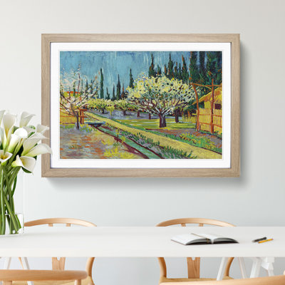 Orchard Bordered by Cypresses by Vincent Van Gogh - Framed Print