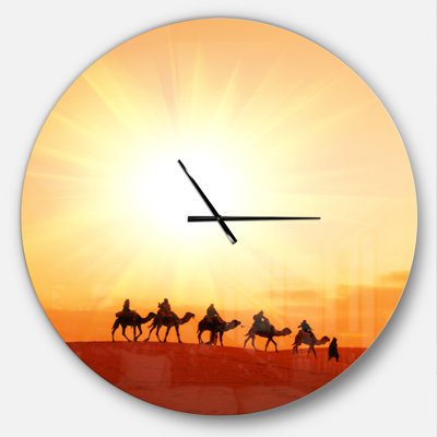 Caravane dans le désert du Sahara - horloge murale moderne
