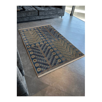 Tapis bleu lavable à motifs géométriques