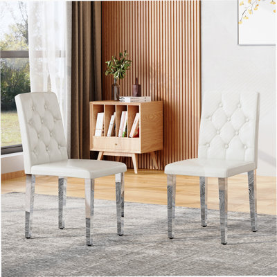 2-Pack Ergonomic PU Dining Chairs With Buckle Backrest And Metal Legs For Comfortable, Stylish Seating In Homes Or Banquet Halls.