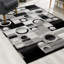 Tapis gris à motif abstrait Dillup-Jones-42050293