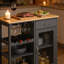 Îlot de cuisine roulant avec support à vin, porte-verres à pied, tiroir, armoire et plateau en bambou pour espaces compacts.