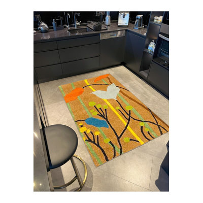 Tapis jaune lavable à base tissée à thème floral