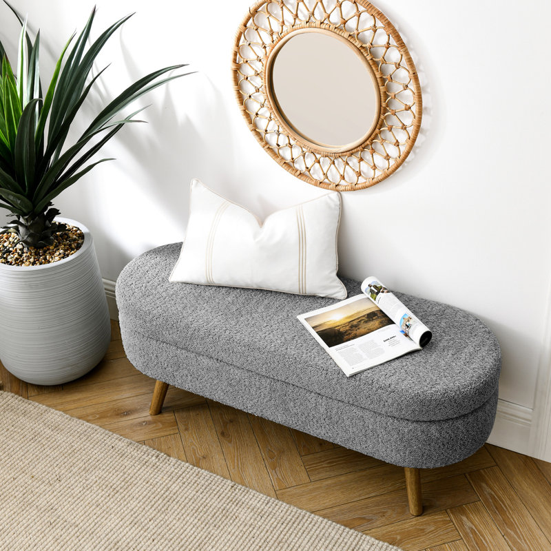 Banc de rangement ovale dans des tons de gris, doté de pieds en bois d'hévéa, fabriqué à la main pour la ténacité, peut servir de tabouret ou de siège et a un compartiment fourni avec une consistance ferme, être utilisé