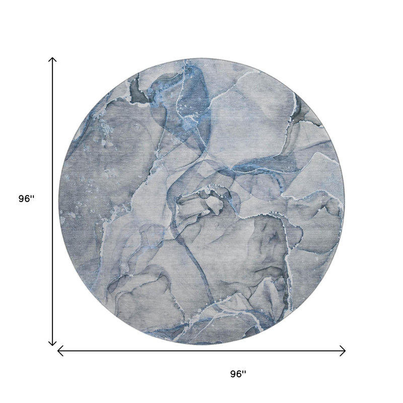Tapis rond lavable abstrait bleu et ivoire 8 pi avec protection UV