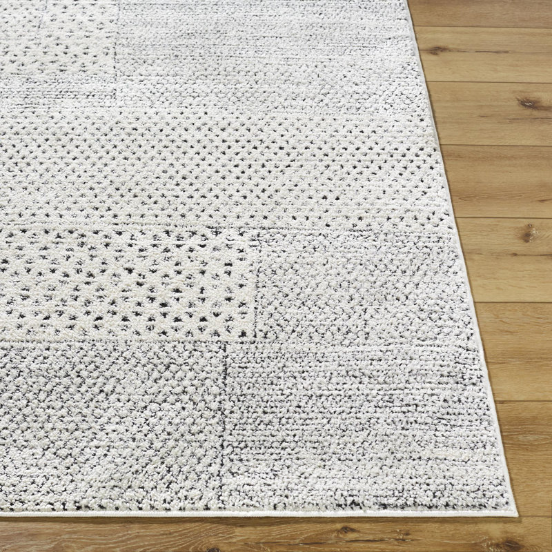 Livabliss 8' x 10' Ivory and Black Synthetic Patchwork Area Rug