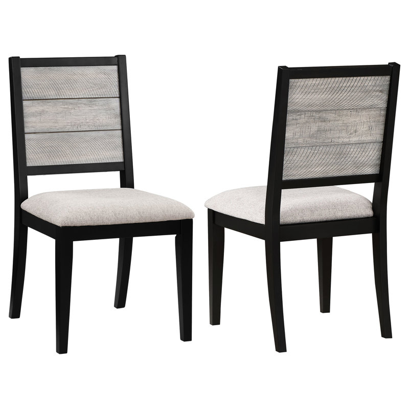 Deux chaises de salle à manger d'appoint, fini noir, revêtement gris, style contemporain, sur un piètement en bois.