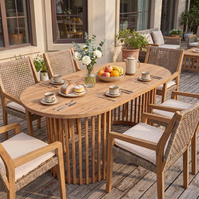 Table de salle à manger d'extérieur ovale en bois d'acacia clair au fini teck clair, conception unique à pieds à lattes verticales, capacité de poids de 500 lb, parfaite pour le jardin et la piscine