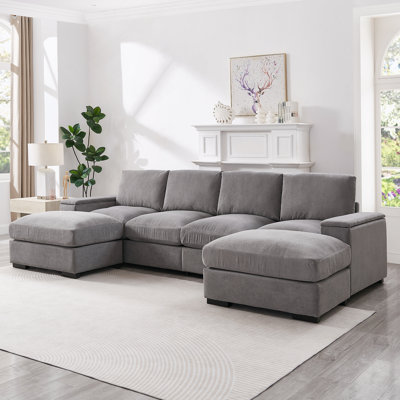 Canapé modulaire avec sièges profonds et repose-pieds amovibles, revêtement en velours côtelé pour un confort et une polyvalence maximaux dans les salons et les bureaux