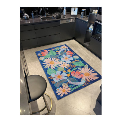 Tapis bleu à motif floral lavable à la machine