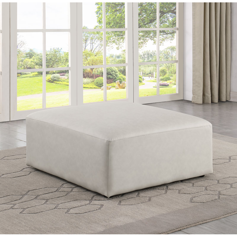 Iyonnie Upholstered Ottoman, Cream Vegan Leather