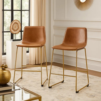 Ensemble de 2 chaises à hauteur de comptoir Cia, siège baquet en similicuir, pieds dorés