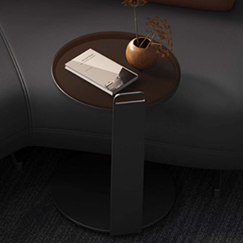 Simple round dark glass tea table