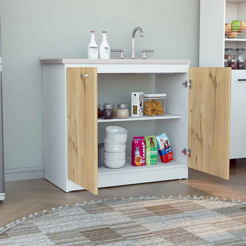 Évier utilitaire avec armoire, une étagère, armoire à deux portes