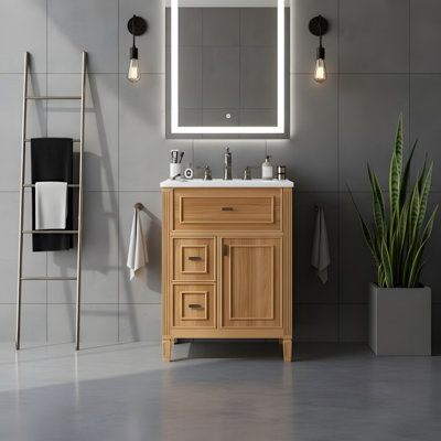 24'' freestanding vanity with a drop-front drawer, two standard drawers, and adjustable shelves