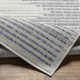 Calliah Striped Polypropylene Area Rug in Blue/Cream