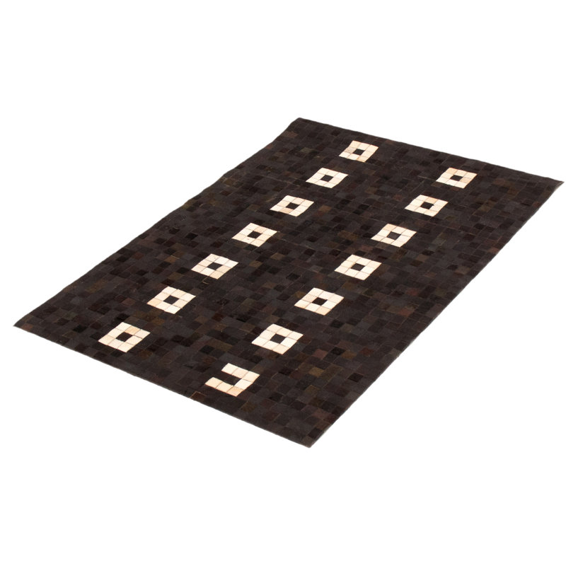 Tapis noir en peau de vache Hanika