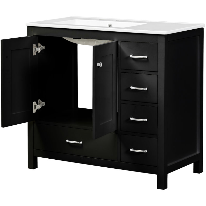 Meuble-lavabo noir 36 po avec lavabo en céramique. Rangement abondant: 2 portes, 5 tiroirs. Dimensions compactes de l 36 po x P 18 po x H 33,9 po. Bois massif et fabrication. Poignées chics en argent pour l'esthétique. Pratique