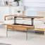 Table basse à plateau relevable avec pieds en verre trempé et plateau en bois aggloméré pour un salon moderne