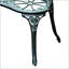 Banc en métal avec accent floral rose et finition antique