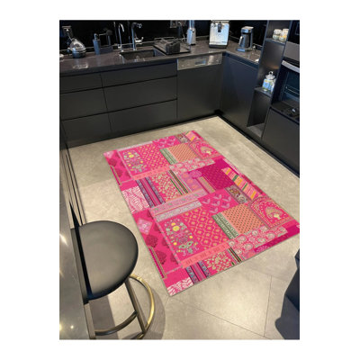 Tapis décoratif tissé rose