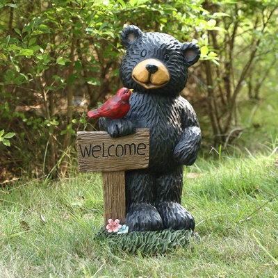 Statue de jardin ours tenant une pancarte de bienvenue