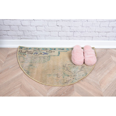Unique Vintage Turkish Rug in Pastel Tones Featuring Subtle Patterns and Half-Circle Design for Cozy Home