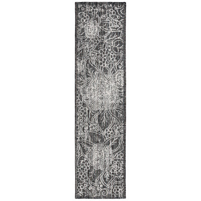 Chrishaunda Hand Tufted Wool Cotton Pet Floral Rug in Black/Ivory