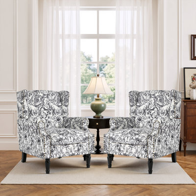 Fauteuil d'appoint à oreilles rembourré floral noir Duward avec garniture cloutée