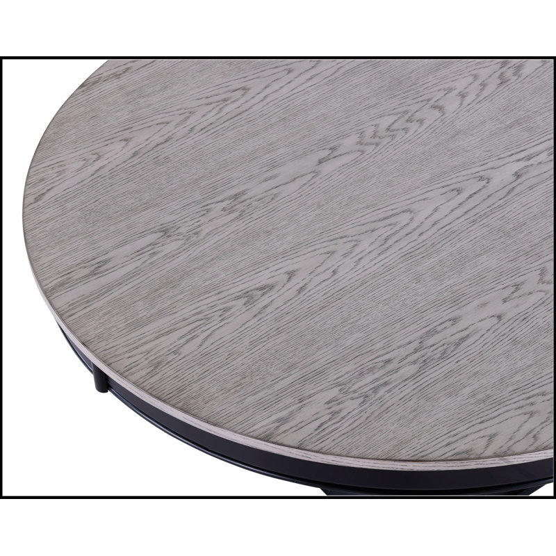 Table de salle à manger ronde contemporaine gris clair avec base noire robuste, parfaite pour les maisons modernes et peu encombrantes