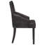 Fauteuil capitonné en cuir noir