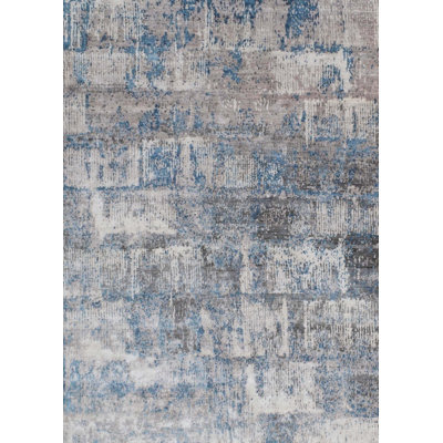 Tapis bleu / ivoire noué à la main