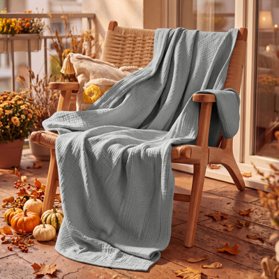 Bedsure 100% Cotton Muslin Blanket, 4-Layer Lightweight Gauze Blanket for Dorm, Couch & All-Season Comfort