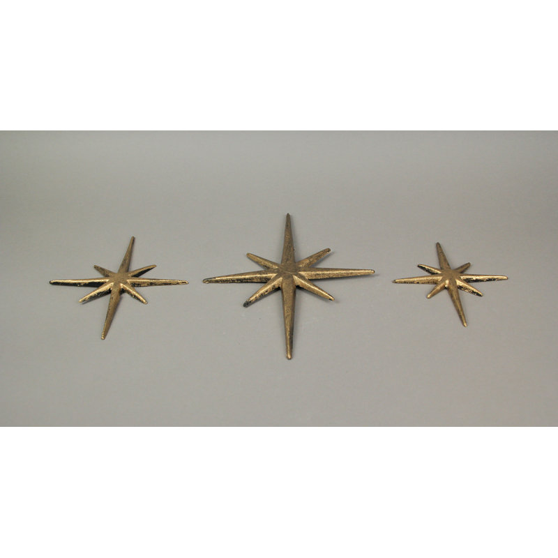 Mid-Century Modern brass-tone gold enamel cast iron 8-point starburst wall art, set of 3 — 8.75x0.25x12, 7x0.25x8.75, 5.75x0.25x6.75 in.