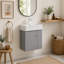 Base de meuble-lavabo mural gris mat de 21,7 po avec tablettes ouvertes du côté droit; la base est vendue comme un seul article.