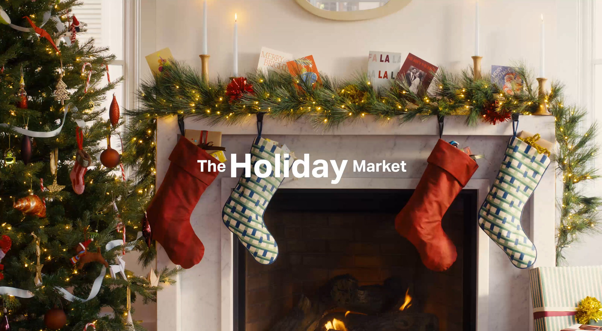 The Holiday Market featuring a decorated Christmas tree and stockings hanging on a fireplace mantel.