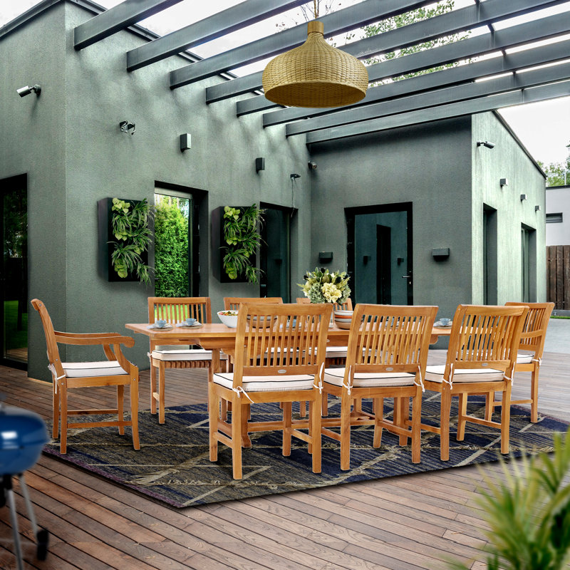 Anquinetta Outdoor 9 - Piece Teak Dining Set with Cushions